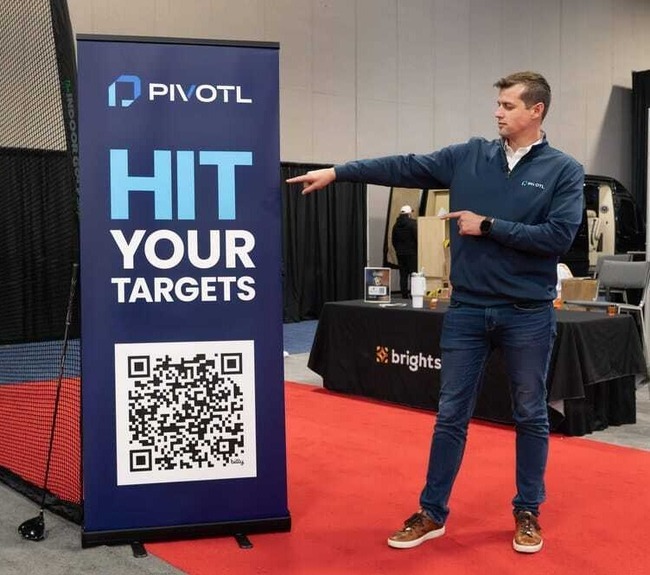 Founder Kurt Denninghoff of Pivotl showcasing financial clarity solutions at trade show booth.